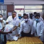 Mr Karti Chidambaram along with Sivagangai District Collector while distributing essential items to the officials and sanitary workers of Sivagangai Medical College on 11.05.2020.